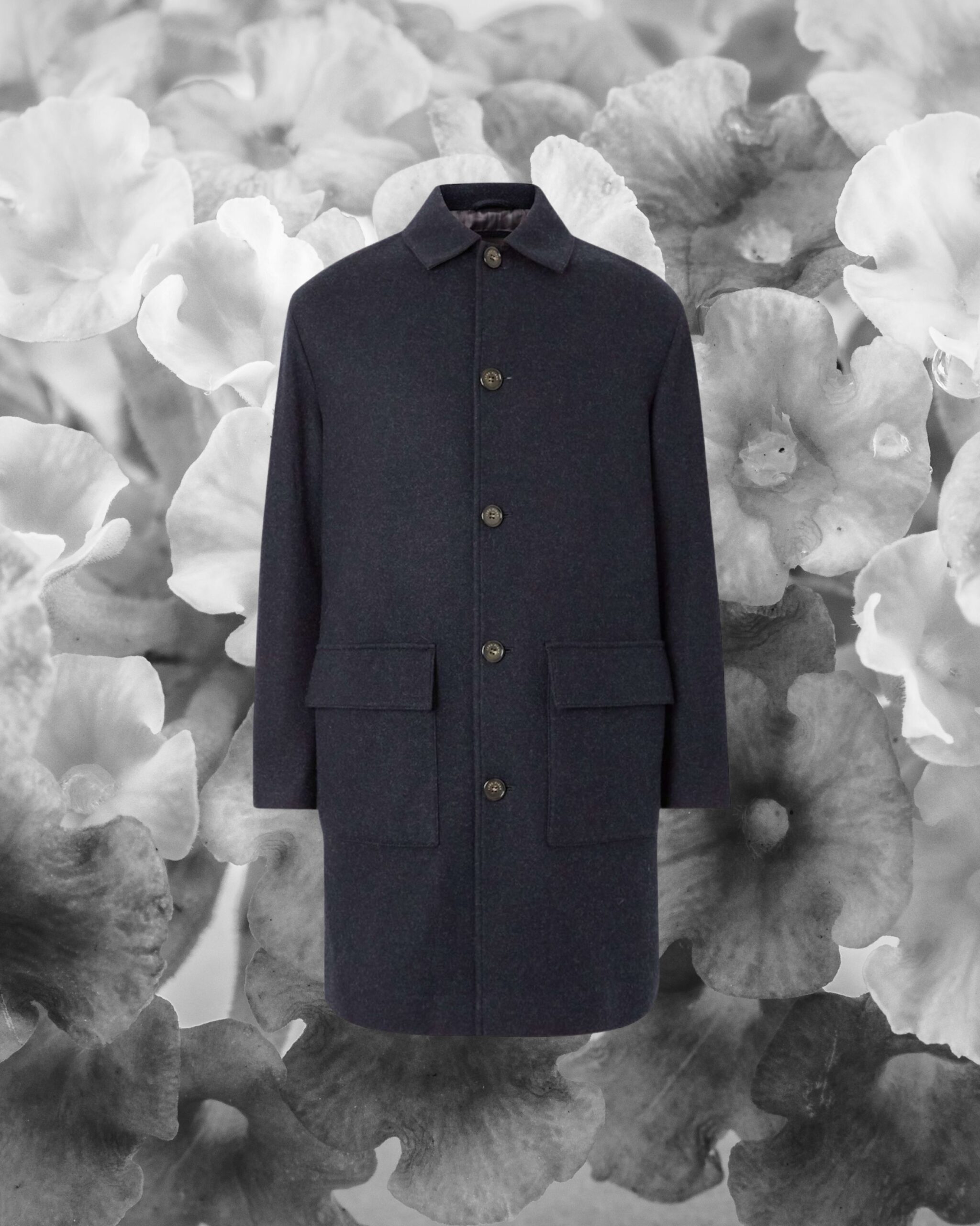 Tailored wool overcoat highlighting craftsmanship, fabric texture, and clean silhouette
